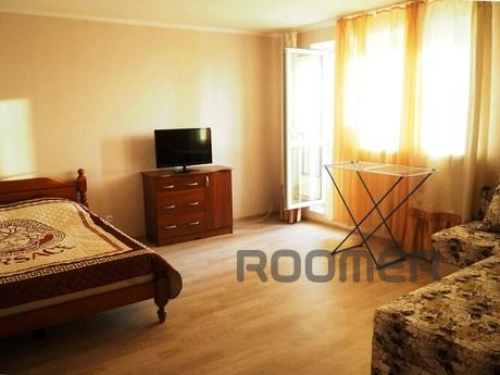 The room has a large double bed and a double sofa. Equipped 