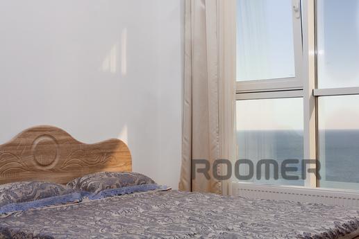 A cozy apartment with a gorgeous panoramic sea view is locat