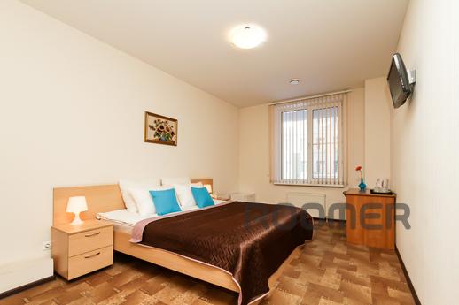 The room has 1 bed with bedside tables and a telephone for c