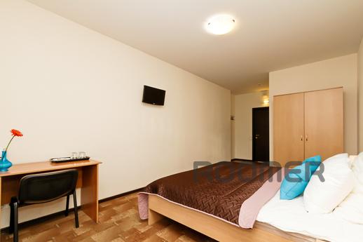 The room has 1 bed with bedside tables and a telephone for c