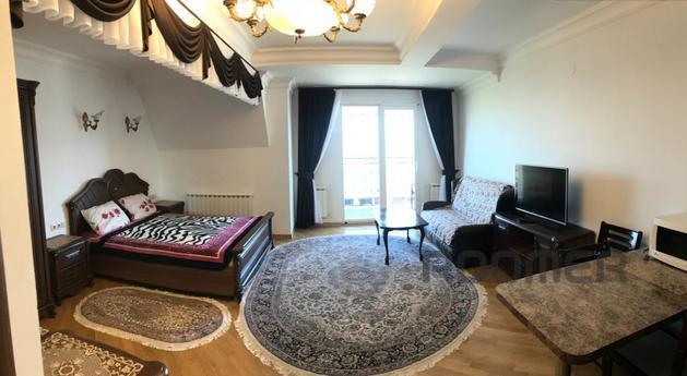 The house is located in a quiet place in the area of the cen