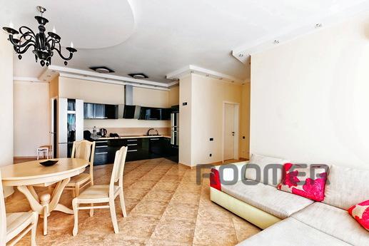 The flat area is 125kv.m Kitchen Studio 50kV. 25kv.m m 2 bed
