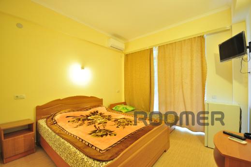 The modern four-storey boarding house offers cozy rooms, loc
