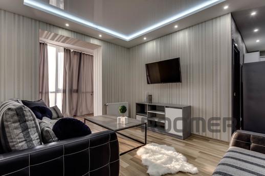 The apartment is modern with new furniture, panoramic window