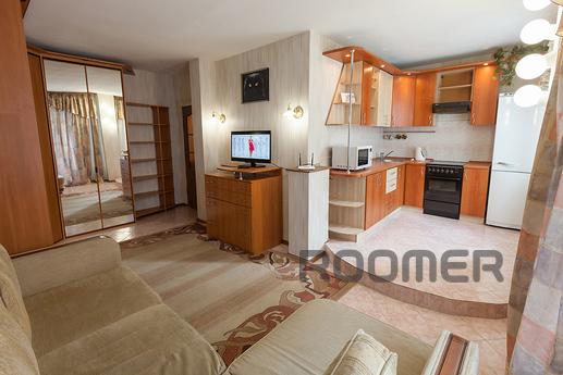 The house is located in the city center, with well-groomed l